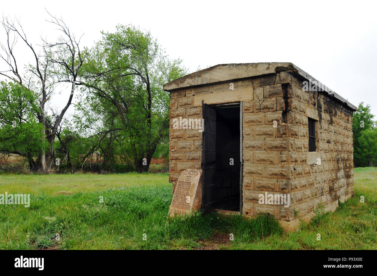 An old one-room territorial jail stands in the Route 66 community of Texola, Oklahoma. The historic structure dates from the early 1900s. Stock Photo