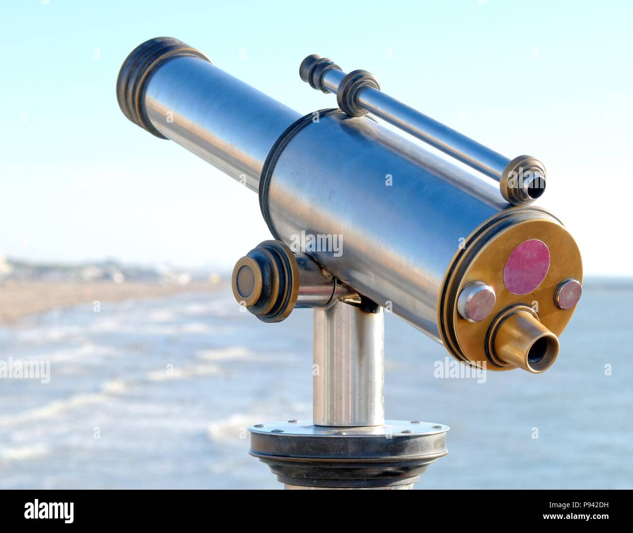 coin operated telescope by the sea Stock Photo