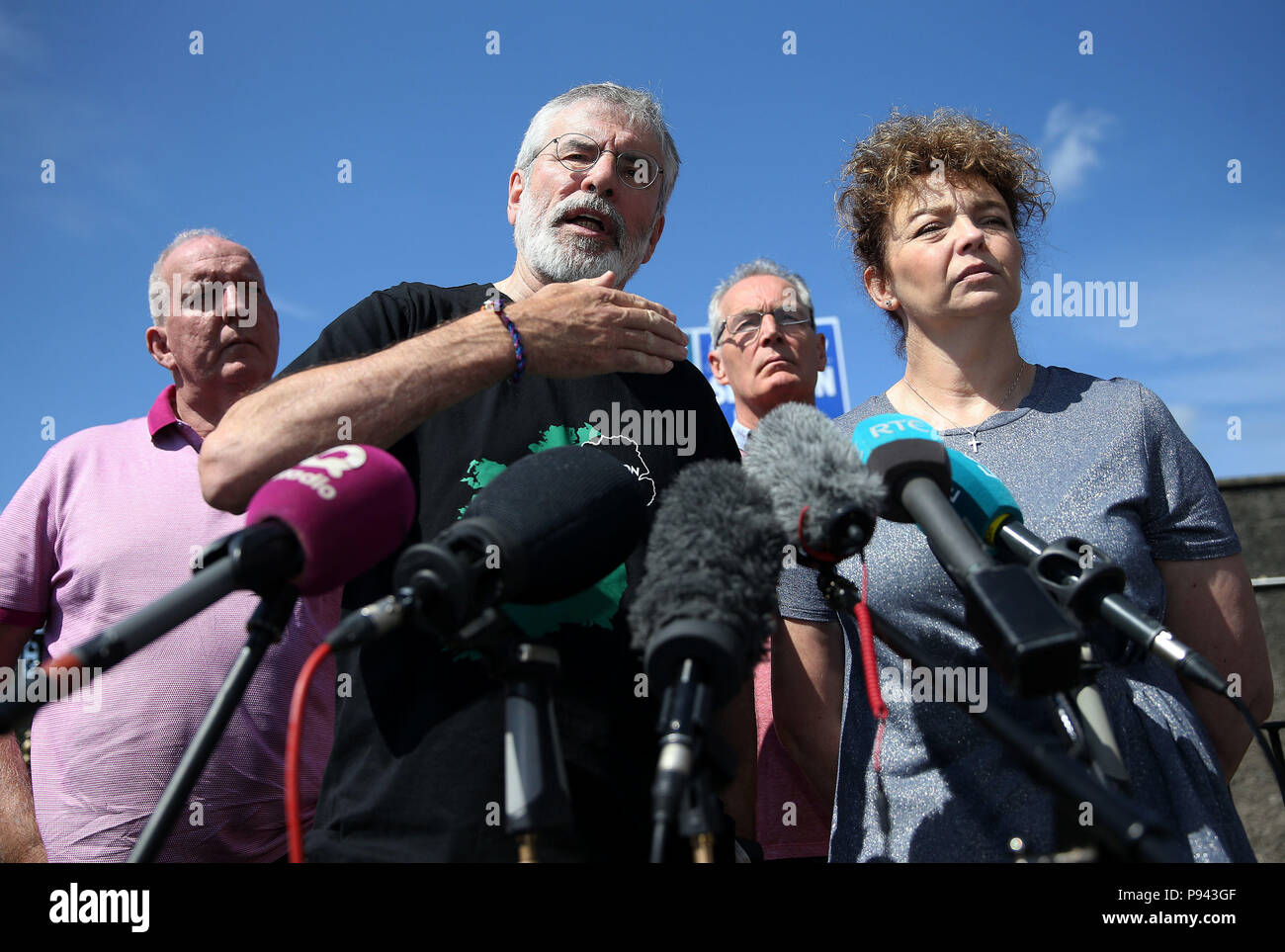 Former Sinn Fein president Gerry Adams at a press conference at Connolly House in Belfast alongside prominent Sinn Fein members (from left) Bobby Storey, Gerry Kelly, and Caral Ni Chuilin following an explosives device attack on his and Bobby Storey's homes. Stock Photo