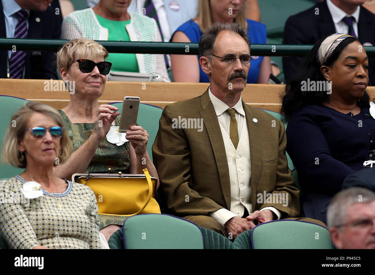 Sir Mark and Lady Rylance in the royal box on centre court on day twelve of the Wimbledon Championships at the All England Lawn Tennis and Croquet Club, Wimbledon. Stock Photo
