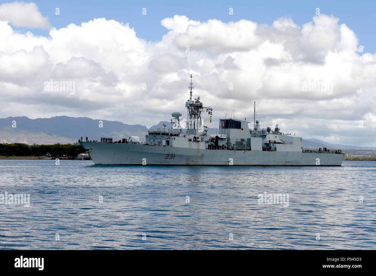 180709-N-OS584-231 PEARL HARBOR (July 09, 2018) Her Majesty's Canadian Ship (HMCS) Vancouver, a Halifax-class frigate of the Royal Canadian Navy, departs Joint Base Pearl Harbor Hickam during RIMPAC 2018. Twenty-five nations, more than 45 ships and submarines, about 200 aircraft and 25,000 personnel are participating in RIMPAC from June 27 to Aug. 2 in and around the Hawaiian Islands and Southern California. The world’s largest international maritime exercise, RIMPAC provides a unique training opportunity while fostering and sustaining cooperative relationships among participants critical to e Stock Photo