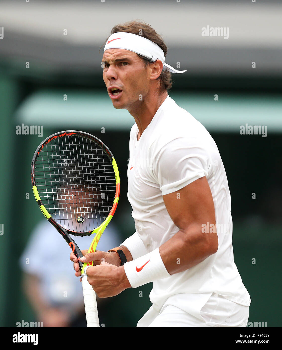 Rafael Nadal reacts on day twelve of the Wimbledon Championships at the All England Lawn Tennis and Croquet Club, Wimbledon. Stock Photo