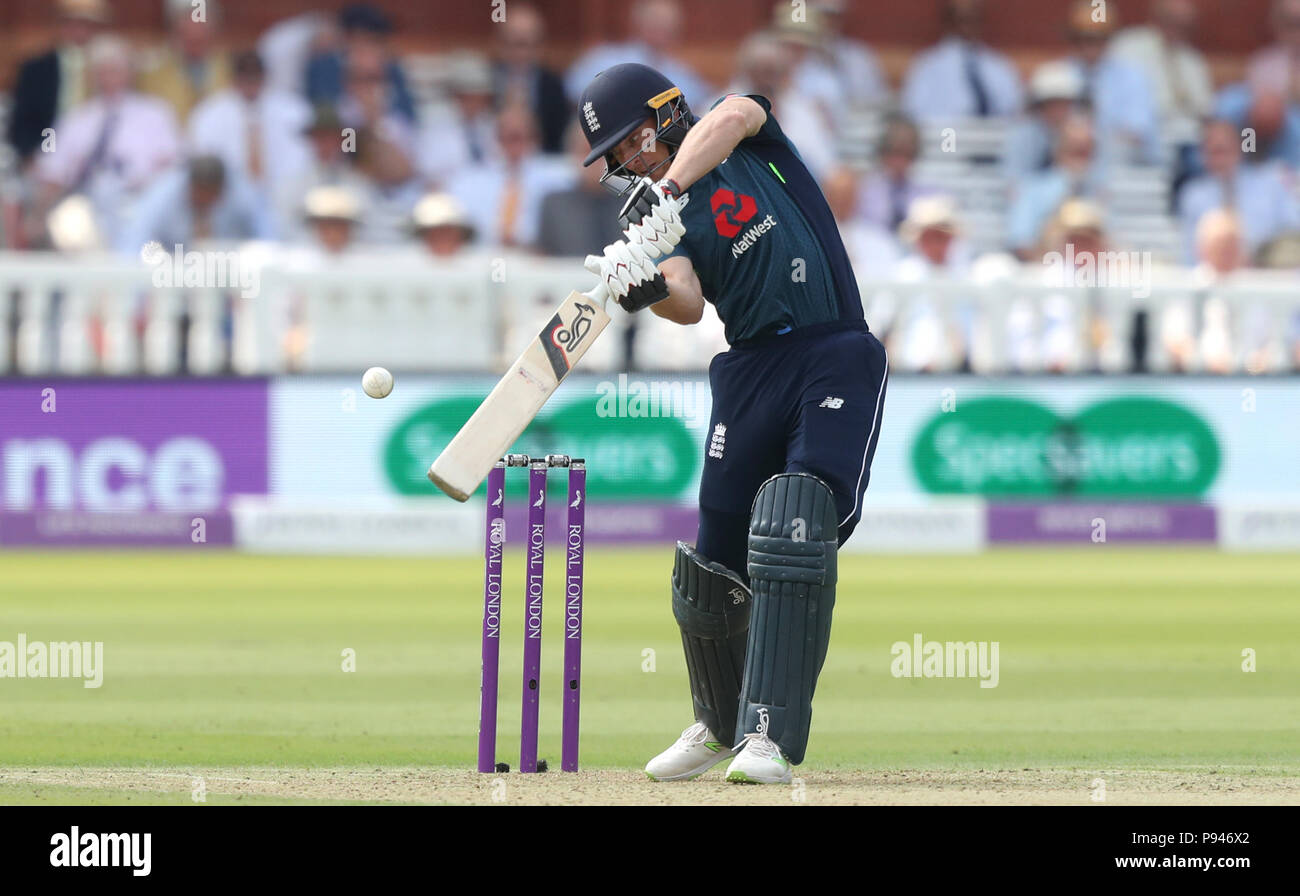 England's Jos Buttler edges the ball through to India's MS Dhoni to be dismissed by India's Umesh Yadav during the second Royal London one day international match at Lord's, London. Stock Photo