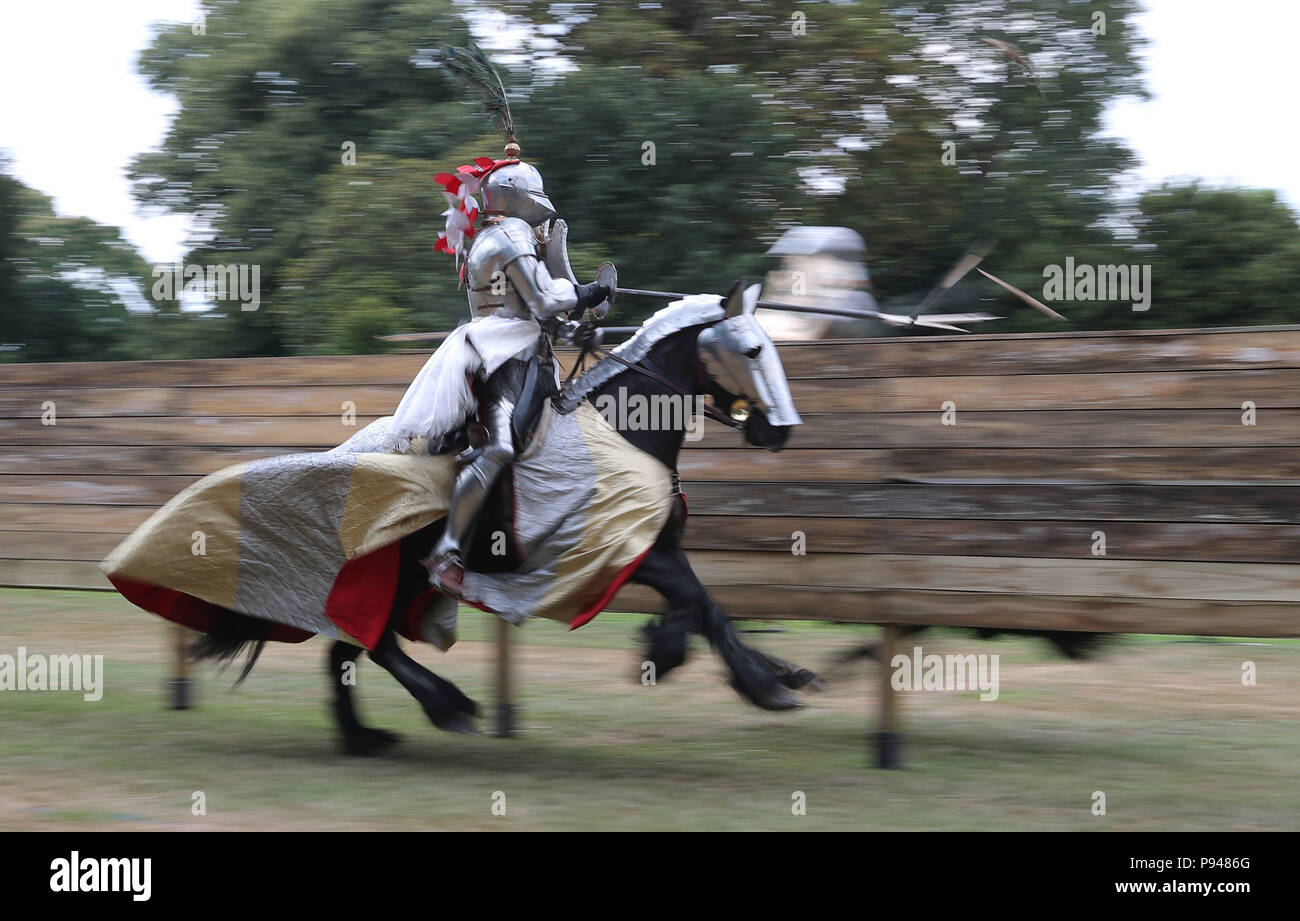 Knights joust during the Tudor Joust Weekend at Hampton Court Palace, in Richmond upon Thames, Surrey. Stock Photo