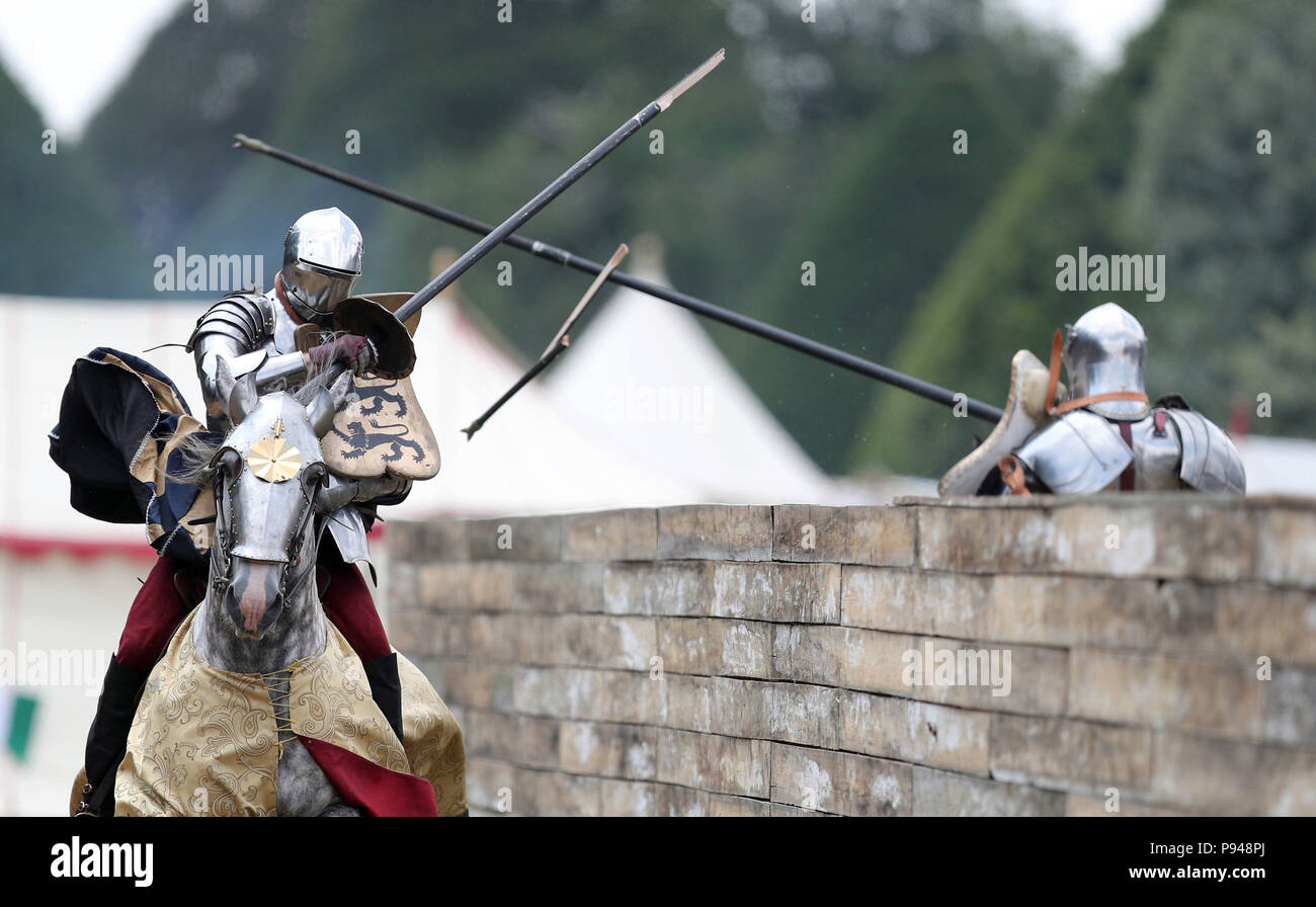 Knights joust during the Tudor Joust Weekend at Hampton Court Palace, in Richmond upon Thames, Surrey. Stock Photo