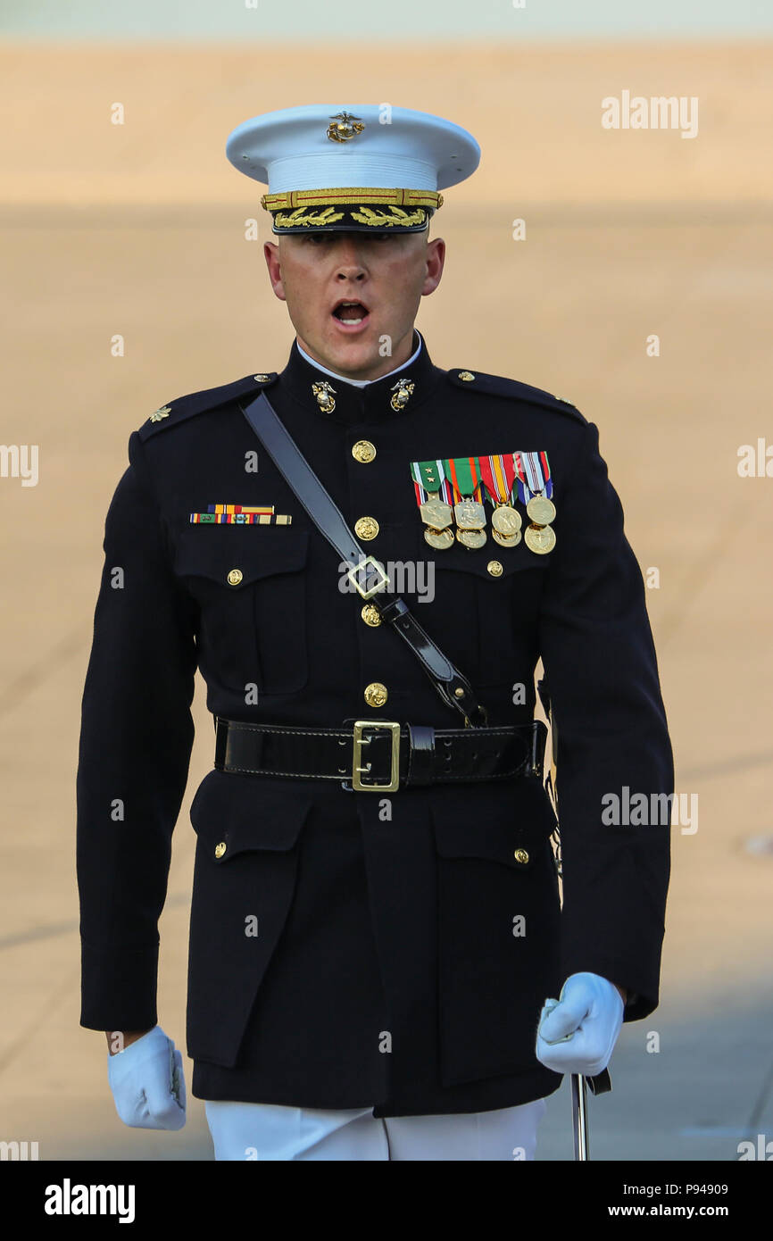 Major Russell Fluker, parade adjutant, Marine Barracks Washington D.C., calls a command during a Tuesday Sunset Parade at the Lincoln Memorial, Washington D.C., July 10, 2018. The guest of honor for the parade was the former Vice President of the U.S., Joe Biden, and the hosting official was the Staff Judge Advocate to the Commandant of the Marine Corps, Maj. Gen. John R. Ewers Jr. (Official Marine Corps photo by Cpl. Damon Mclean/Released) Stock Photo
