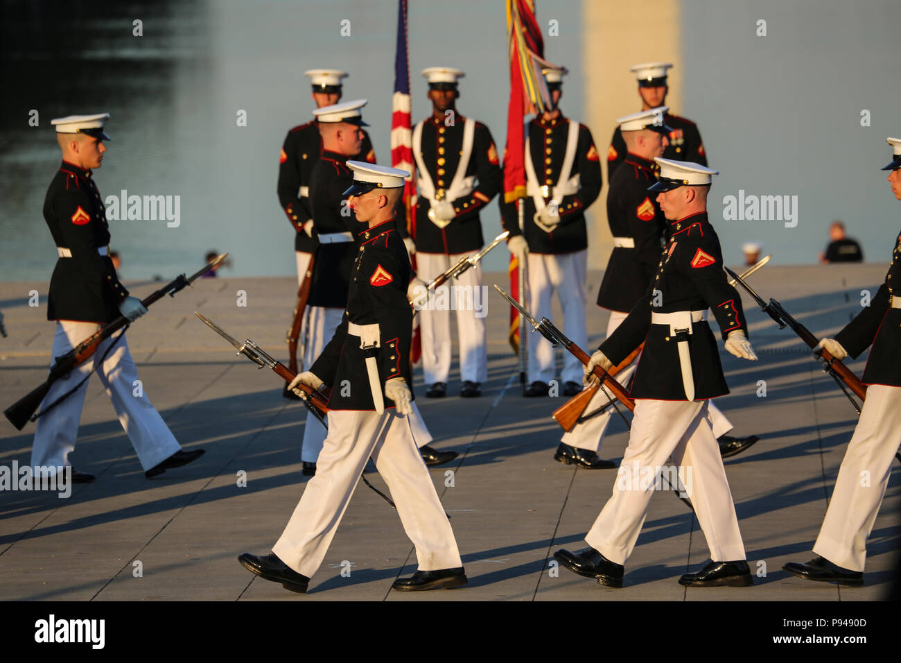 Marines with the U.S. Marine Corps Silent Drill Platoon execute precision rifle drill movements during a Tuesday Sunset Parade at the Lincoln Memorial, Washington D.C., July 10, 2018. The guest of honor for the parade was the former Vice President of the U.S., Joe Biden, and the hosting official was the Staff Judge Advocate to the Commandant of the Marine Corps, Maj. Gen. John R. Ewers Jr. (Official Marine Corps photo by Cpl. Damon Mclean/Released) Stock Photo