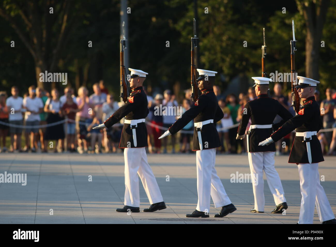 Marines with the U.S. Marine Corps Silent Drill Platoon execute precision rifle drill movements during a Tuesday Sunset Parade at the Lincoln Memorial, Washington D.C., July 10, 2018. The guest of honor for the parade was the former Vice President of the U.S., Joe Biden, and the hosting official was the Staff Judge Advocate to the Commandant of the Marine Corps, Maj. Gen. John R. Ewers Jr. (Official Marine Corps photo by LCpl Bourgeois/Released) Stock Photo