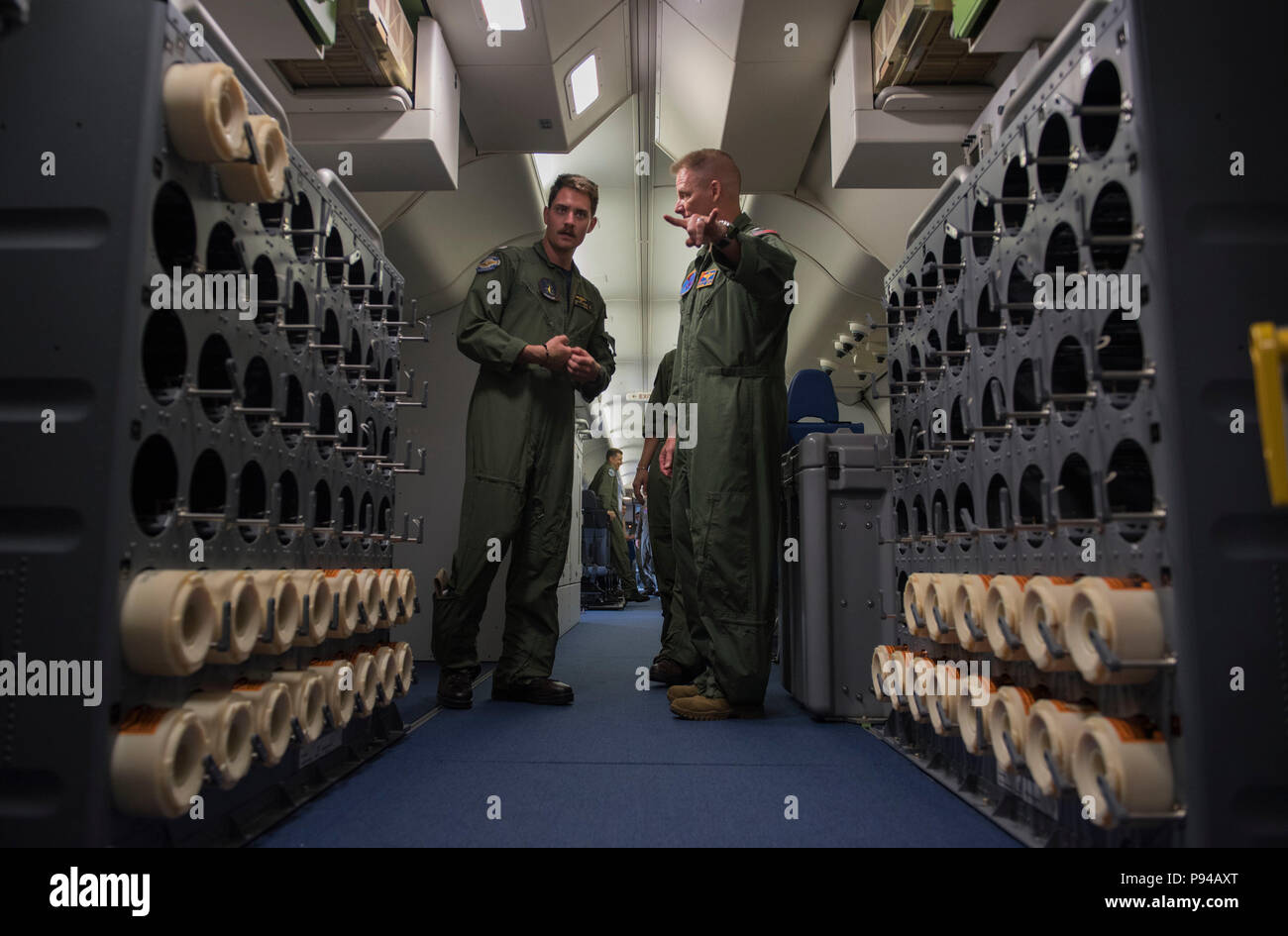 180711-N-OU129-214 CLARK AIR BASE, Philippines (July 11, 2018) Rear Adm. Joey Tynch, Commander, Task Force 73, discusses the capabilities of a P-8 Poseidon maritime surveillance aircraft with Lt. Jack Williamson from Patrol Squadron Four (VP-4) as a part of Maritime Training Activity (MTA) Sama Sama 2018. The week-long engagement focuses on the full spectrum of naval capabilities and is designed to strengthen the close partnership between both navies while cooperatively ensuring maritime security, stability and prosperity. (U.S. Navy photo by Mass Communication Specialist 2nd Class Joshua Fult Stock Photo
