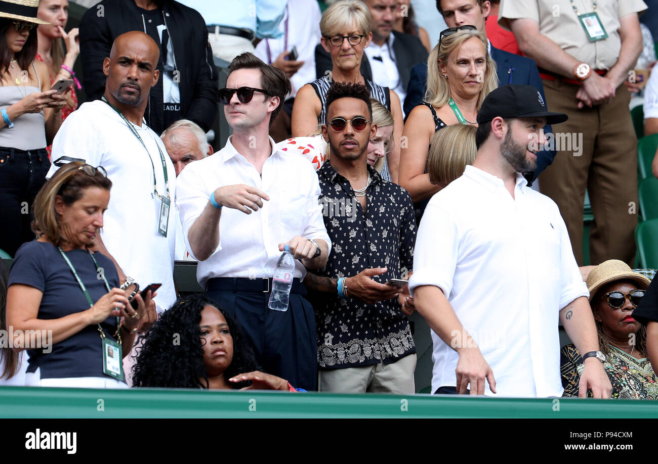 Lewis Hamilton (centre) in the players box of centre court on day