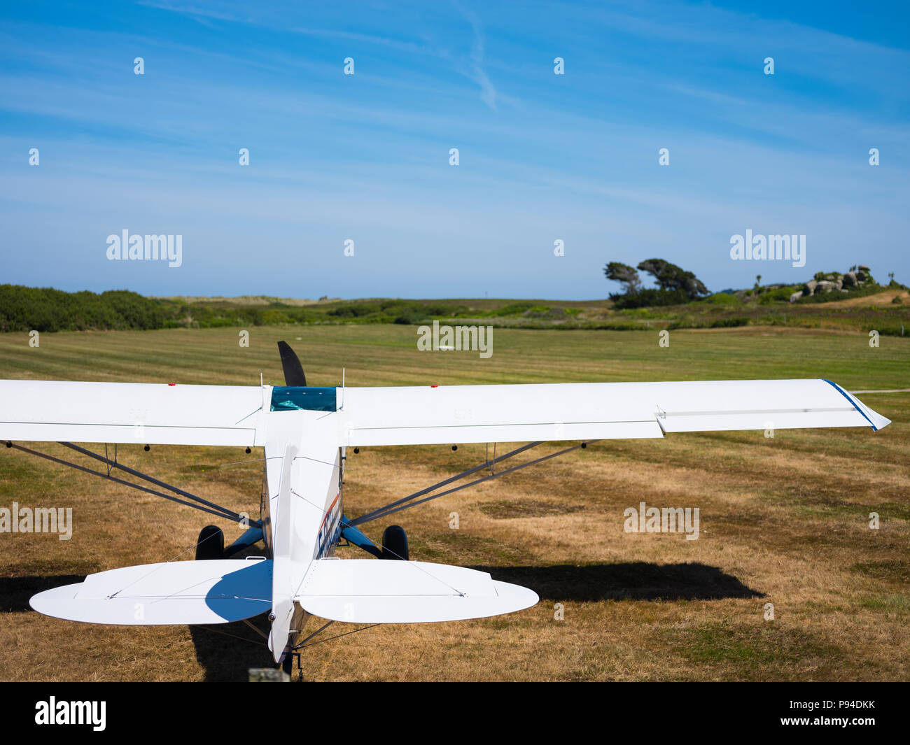 A small white passenger plane, Tresco, Isles of Scilly. Stock Photo