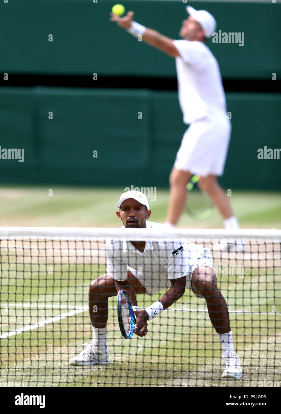 Raven Klaasen and Michael Venus during the Gentlemen's Doubles Final on day twelve of the Wimbledon Championships at the All England Lawn Tennis and Croquet Club, Wimbledon. PRESS ASSOCIATION Photo. Picture date: Saturday July 14, 2018. See PA story TENNIS Wimbledon. Photo credit should read: Steven Paston/PA Wire. Stock Photo