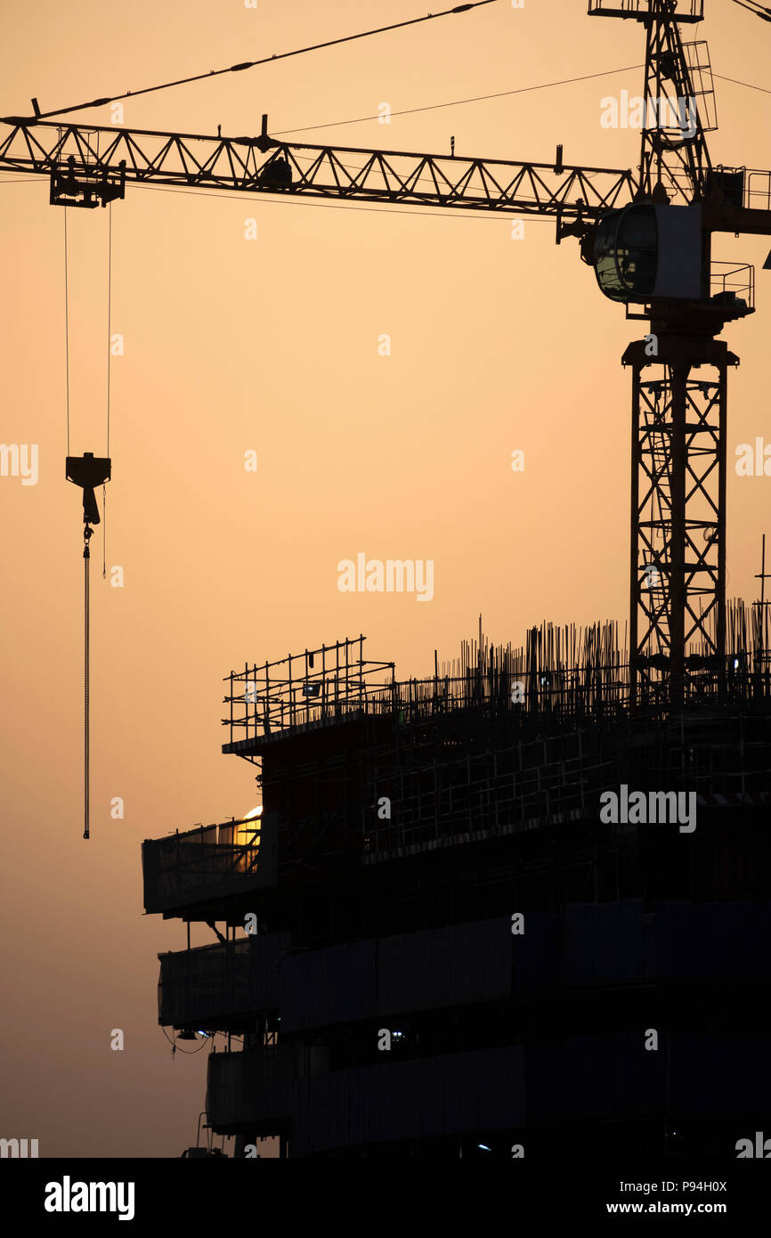 Sunrise Hazy Dubai Sky over Construction Site Stock Photo