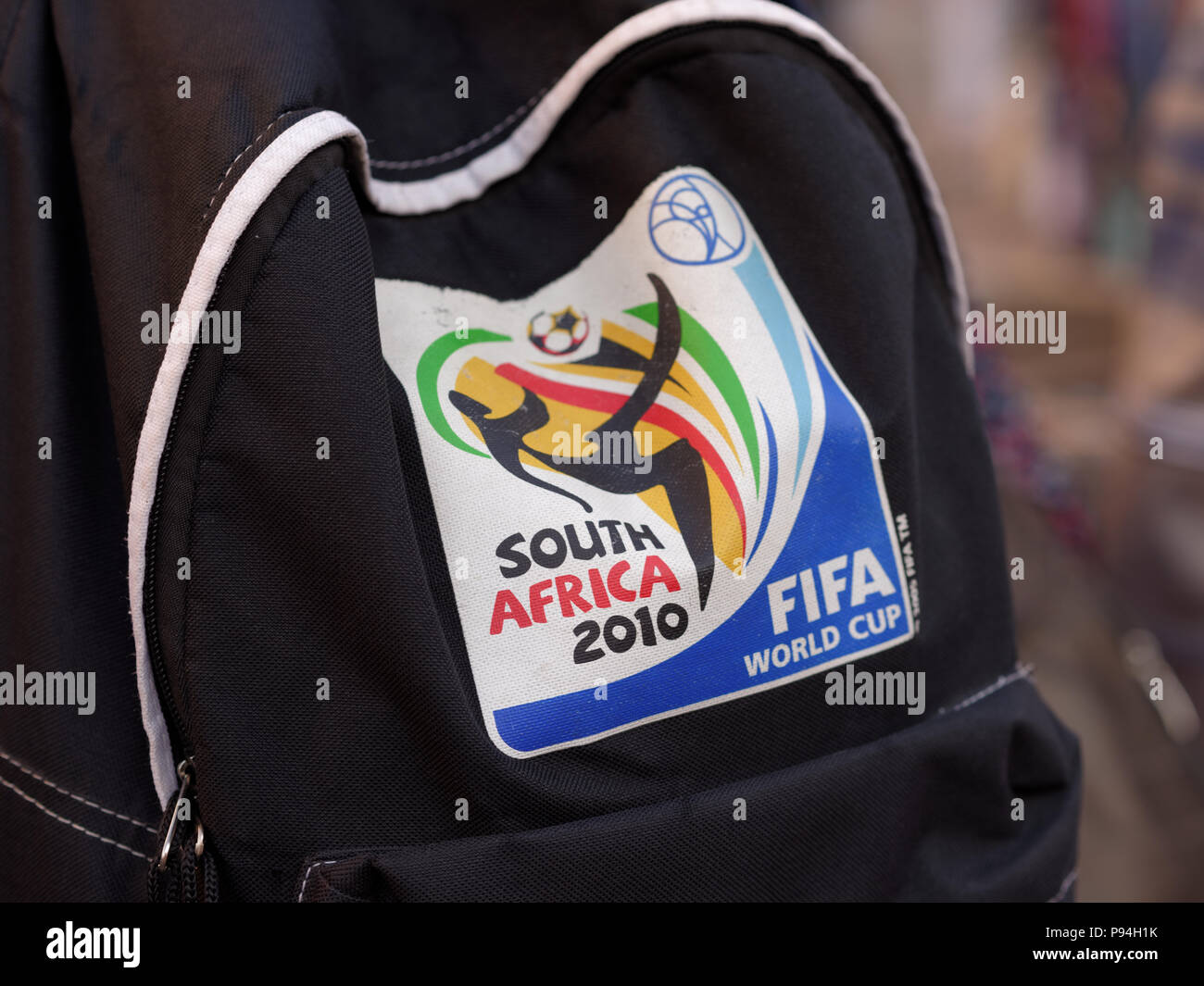 St. Petersburg, Russia - July 13, 2018: Logo of FIFA World Cup South Africa 2010 on the backpack of a football fan visited FIFA World Cup Russia 2018. Stock Photo