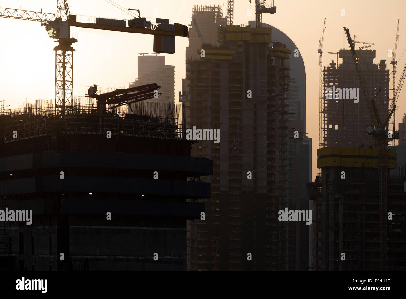 Sunrise Hazy Dubai Sky over Construction Site Stock Photo