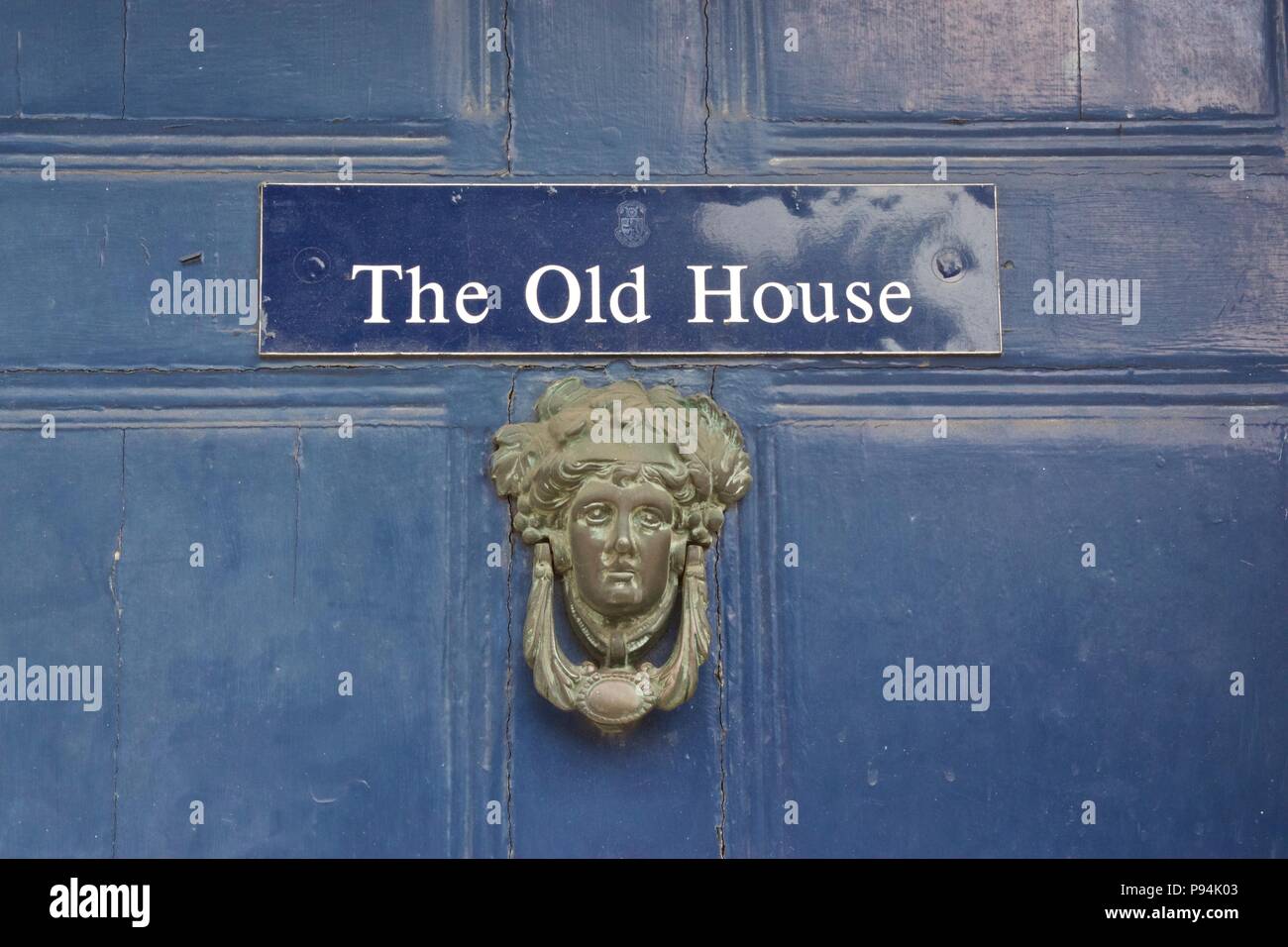 A Harrow school 'The Old House' sign on a blue door on Harrow-On-The-Hill Stock Photo