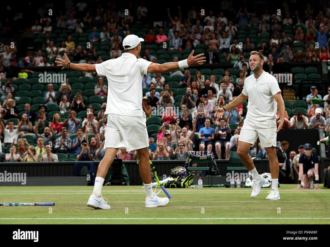 Mike Bryan and Jack Sock (right) celebrate winning the Gentlemen's Doubles final on day twelve