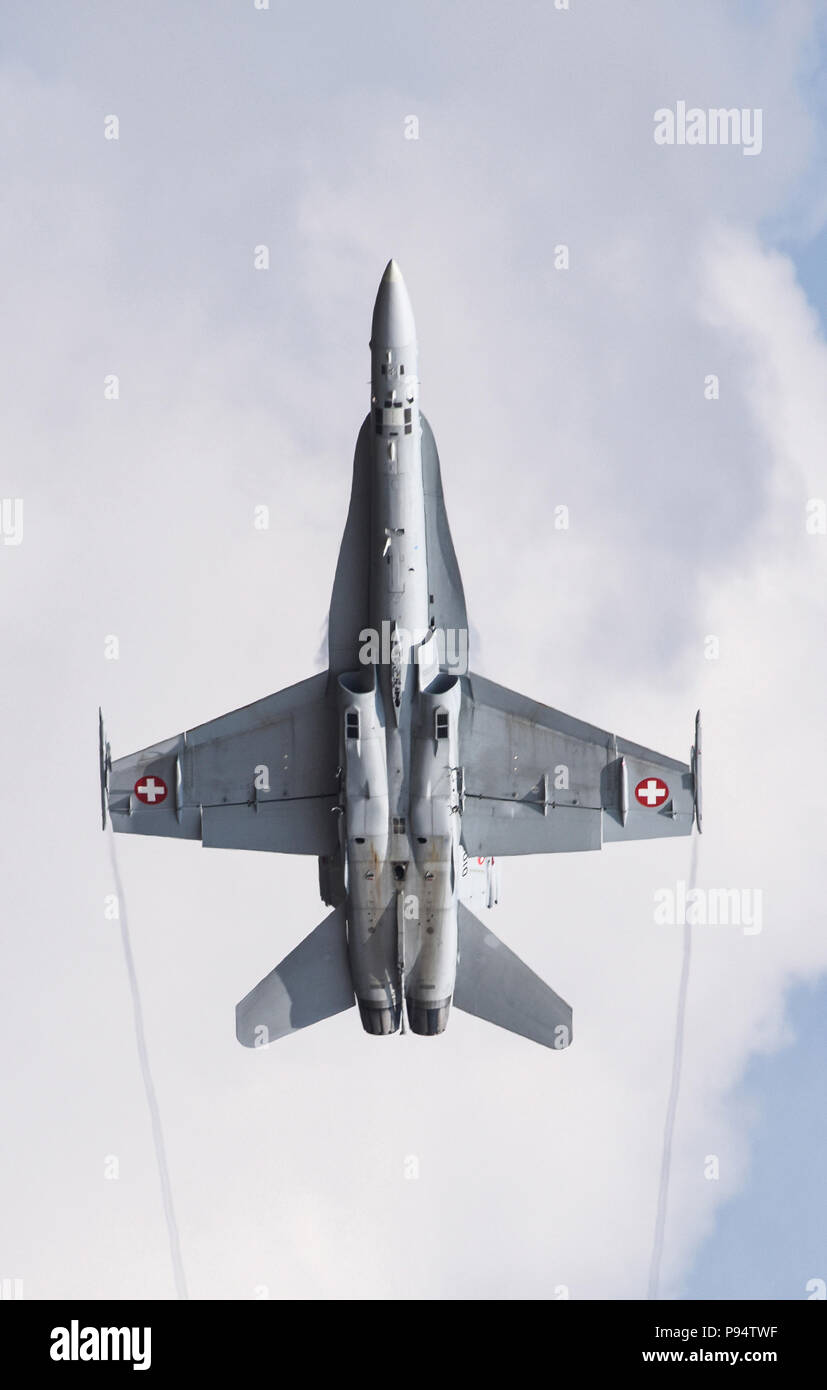 A pilot from the Swiss Air Force demonstrates the flight capabilities of a F/A-18C Hornet during the 2018 Royal International Air Tattoo at RAF Fairford, United Kingdom on July 13, 2018. This year’s RIAT celebrated the 100th anniversary of the RAF and highlighted the United States’ ever-strong alliance with the UK. (U.S. Air Force photo by TSgt Brian Kimball) Stock Photo