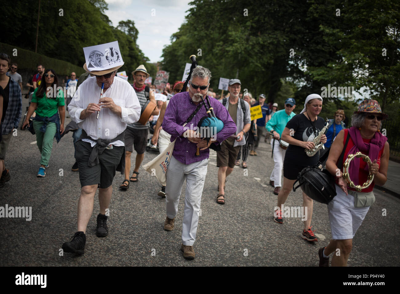 Edinburgh, Scotland, on 14 July 2018. 'Carnival of Resistance' anti-Trump rally, coinciding with the visit of President Donald Trump, and his wife Melania, to Scotland on a golfing weekend. The rally, which was attended by 1,000's of people protesting the policies of President Trump and his visit to the United Kingdom, made its way from the Scottish Parliament through the streets of the city. Credit: jeremy sutton-hibbert/Alamy Live News Stock Photo