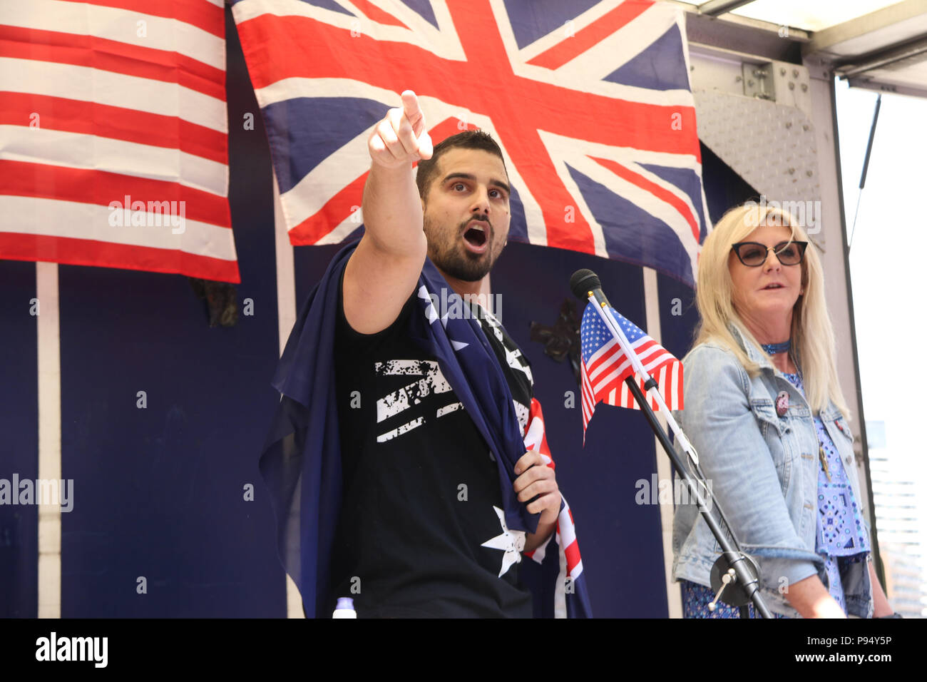 London, England. 14th July 2018. Despite police attempts to prevent the pro-Trump protest due to fears of violence from far-left counter protesters, supporters of Donald Trump assembled at midday outside the US Embassy in Vauxhall, London to welcome him on his visit to the UK. Pictured: Avi Yemini and Debbie Robinson from Australian Liberty Alliance. Credit: Richard Milnes/Alamy Live News Stock Photo