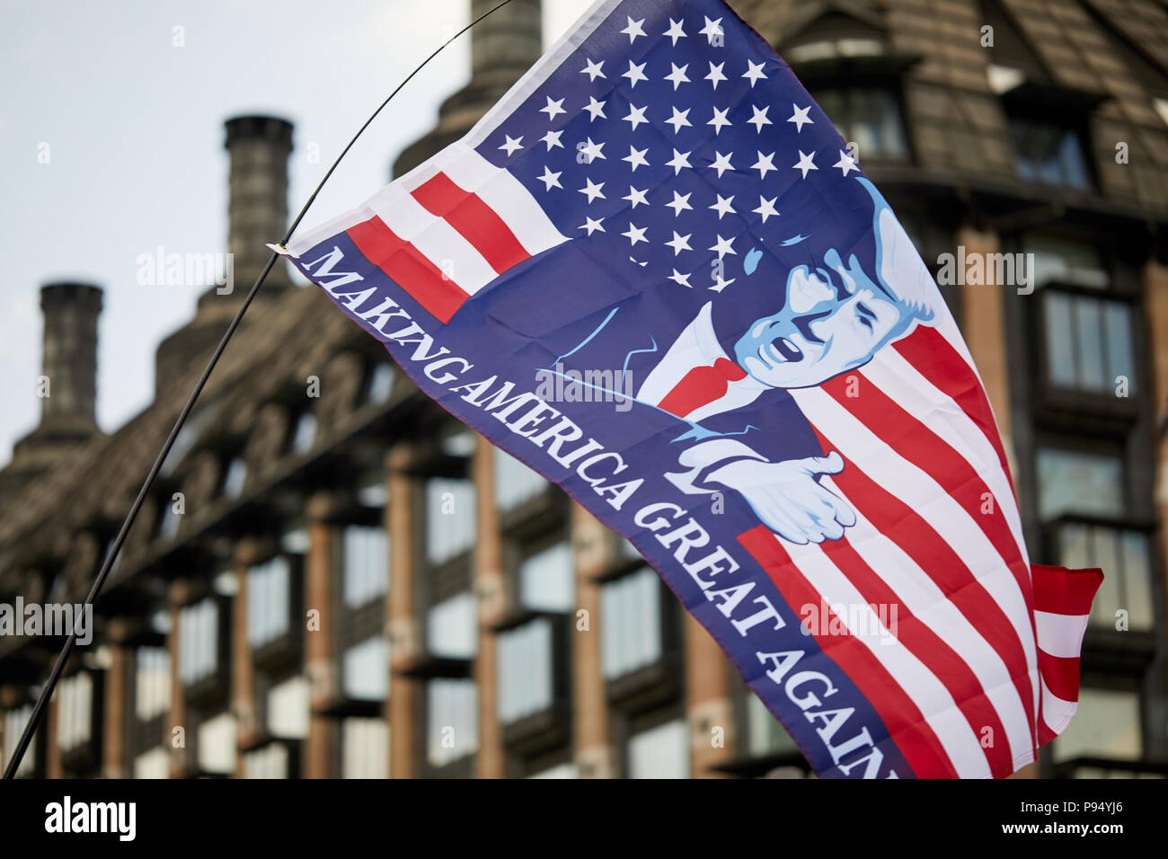 London, U.K. - 14 July 2018: A 'Making America Great Again' flies in front of Portcullis House, Westminster during a Pro-Donald Trump rally and march. Stock Photo
