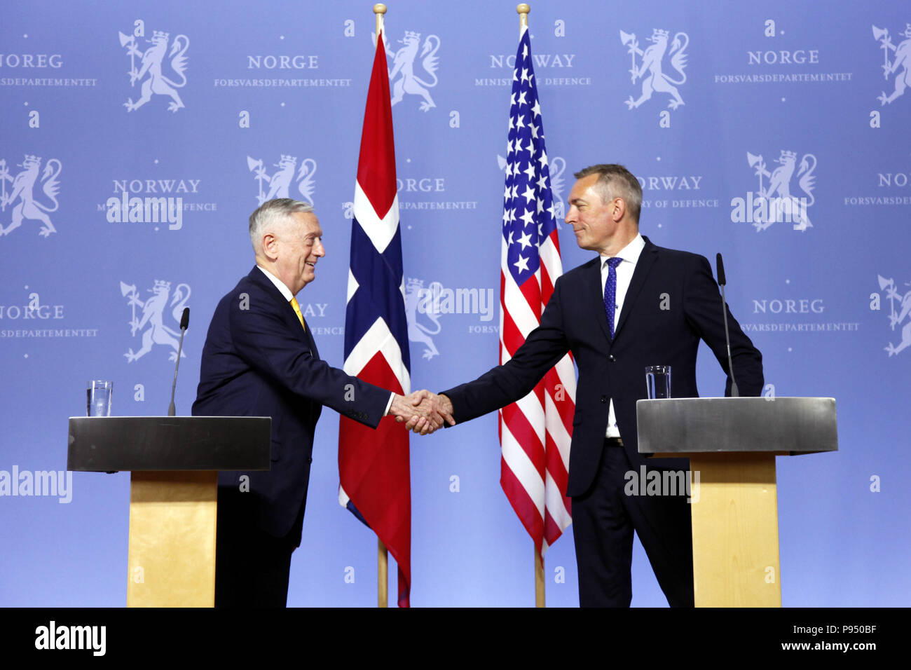 Oslo, Norway. 14th July, 2018. U.S. Secretary of Defense James Mattis (L) shakes hands with Norwegian Minister of Defence Frank Bakke-Jensen at a joint press conference in Oslo, Norway, July 14, 2018. Norway on Saturday reconfirmed its commitment to gradually increase defense spending to two percent of GDP in the North Atlantic Treaty Organization (NATO) during a visit by U.S. Secretary of Defense James Mattis to the Nordic country. Credit: Liang Youchang/Xinhua/Alamy Live News Stock Photo