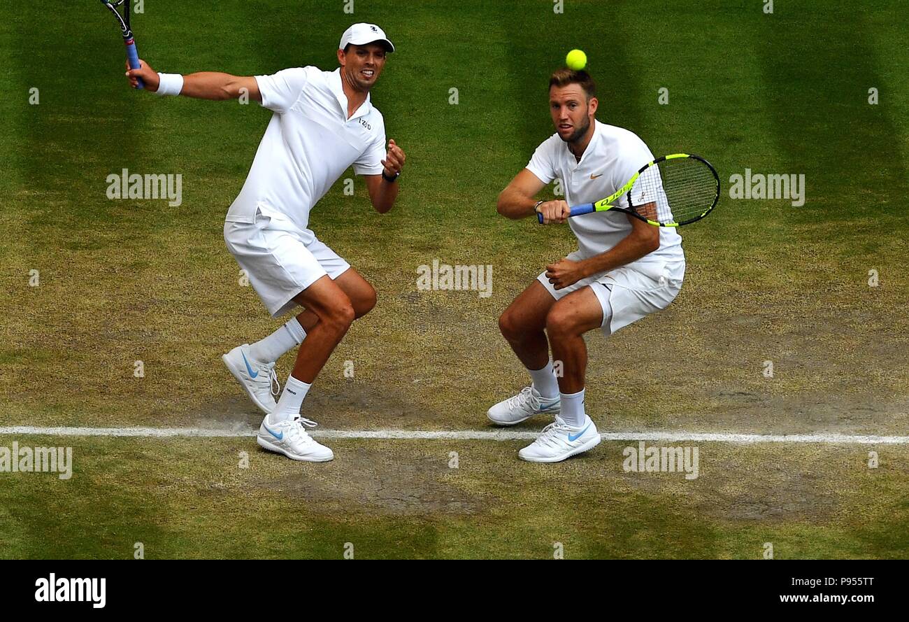 London, Britain. 14th July, 2018. Mike Bryan (L) and Jack Sock of the United States compete during the Gentlemen's Doubles Final against Michael Venus of New Zealand and Raven Klaasen of South Africa at the Wimbledon Championships 2018 in London, Britain, on July 14, 2018. Mike Bryan and Jack Sock won 3-2 and claimed the champion. Credit: Guo Qiuda/Xinhua/Alamy Live News Stock Photo