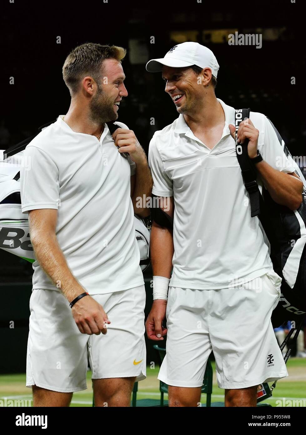 London, Britain. 14th July, 2018. Mike Bryan (R) and Jack Sock of the United States celebrate after the Gentlemen's Doubles Final against Michael Venus of New Zealand and Raven Klaasen of South Africa at the Wimbledon Championships 2018 in London, Britain, on July 14, 2018. Mike Bryan and Jack Sock won 3-2 and claimed the champion. Credit: Guo Qiuda/Xinhua/Alamy Live News Stock Photo