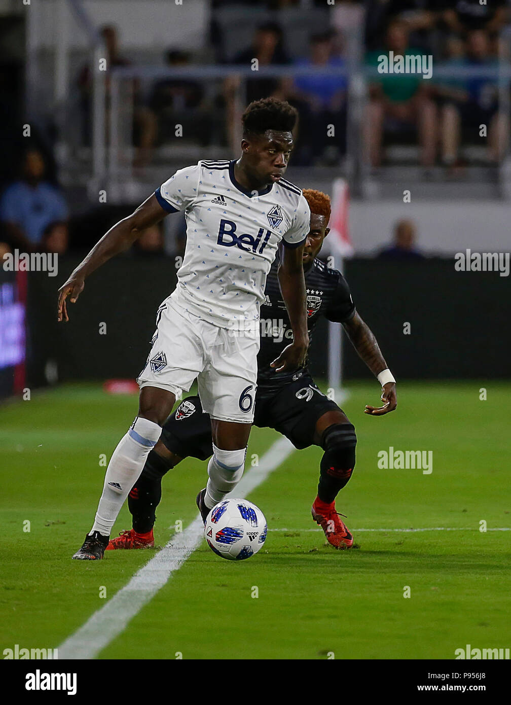 Vancouver, Vancouver. 5th Mar, 2017. Alphonso Davies (R) of Vancouver  Whitecaps vies with Keegan Rosenberry of Philadelphia Union during their  Major League Soccer (MLS) match at BC Place, Vancouver, Canada on March