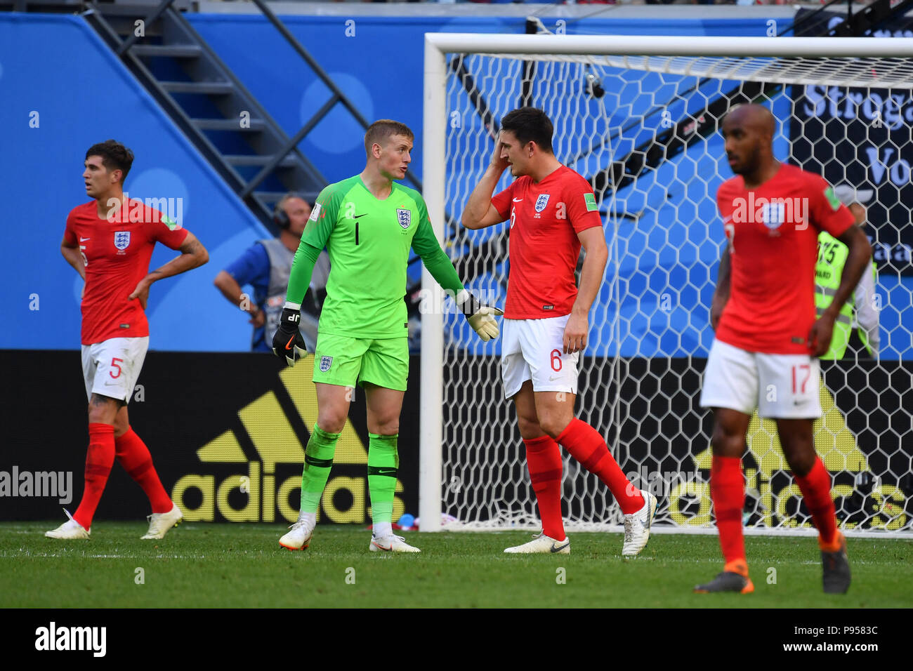 St. Petersburg, Russland. 14th July, 2018. See: John STONES (ENG), goalkeeper Jordan PICKFORD (ENG), Harry MAGUIRE (ENG), Fabian DELPH (ENG). after versustor, disappointment, frustrated, disappointed, frustrated, dejected, action. Belgium (BEL) - ENGLAND (ENG) 2-0, match 63, match for 3rd place, on 07/14/2018 in Saint Petersburg, Arena Saint Petersburg, Football World Cup 2018 in Russia from 14.06. - 15.07.2018. | usage worldwide Credit: dpa/Alamy Live News Stock Photo