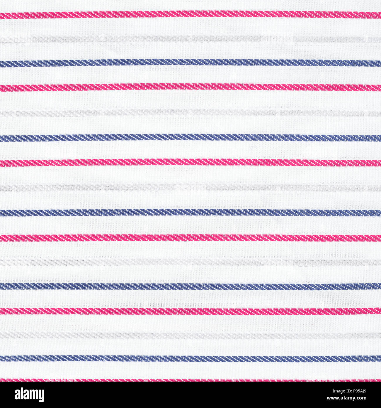 White fabric texture with red and blue stripes pattern. Closeup Stock Photo