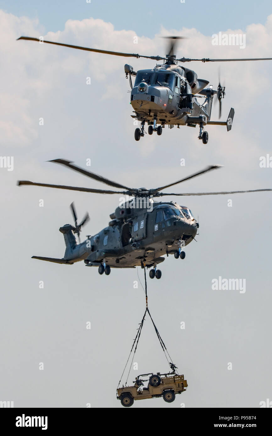 Wildcat and Merlin helicopters taking part in the Commando Assault at Yeovilton Air Day, RNAS Yeovilton, UK on the 7th July 2018. Stock Photo