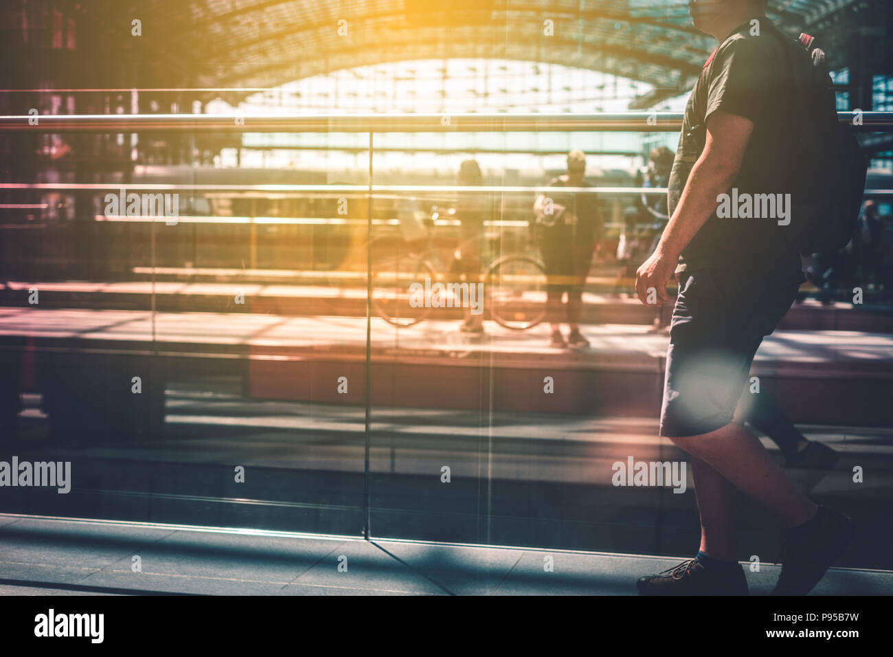 Travel concept, people with luggage walking on train station platform Stock Photo