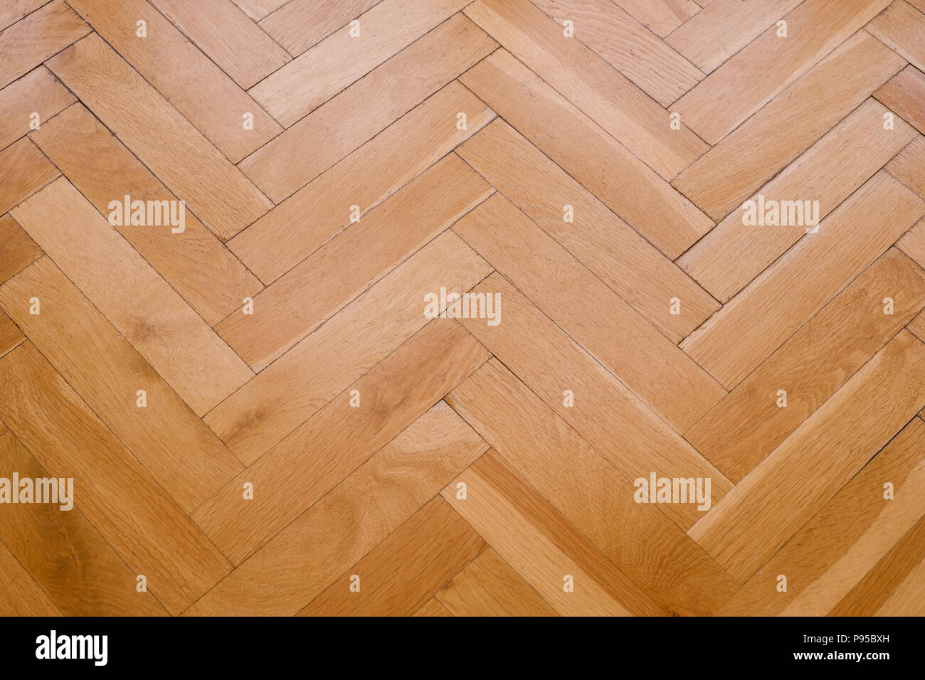 parquet floor, wooden floor closeup - herringbone Stock Photo