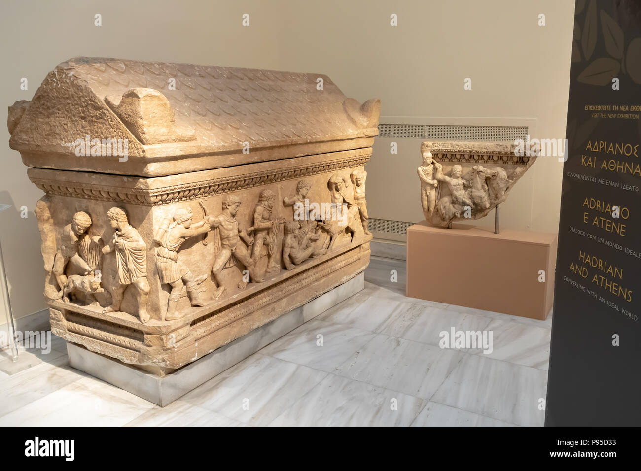 Attic Sarcophagus, Pentelic Marble, Calydonian Boar Hunt, Found in Aysios Ioannis, Patras, Attica, Two young men confronting a lion. 150-170 AD. Stock Photo