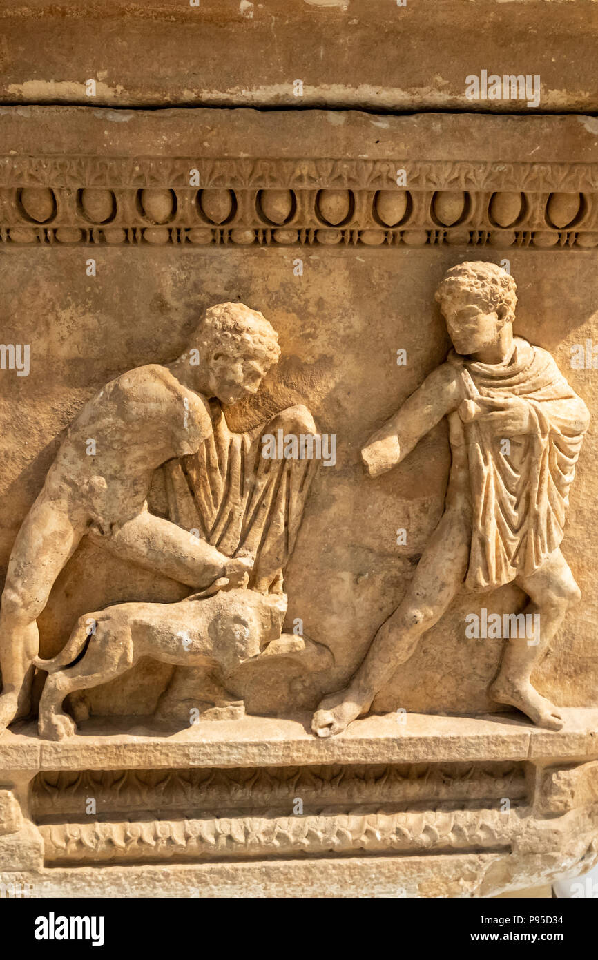Attic Sarcophagus, Pentelic Marble, Calydonian Boar Hunt, Found in Aysios Ioannis, Patras, Attica, Two young men confronting a lion. 150-170 AD. Stock Photo