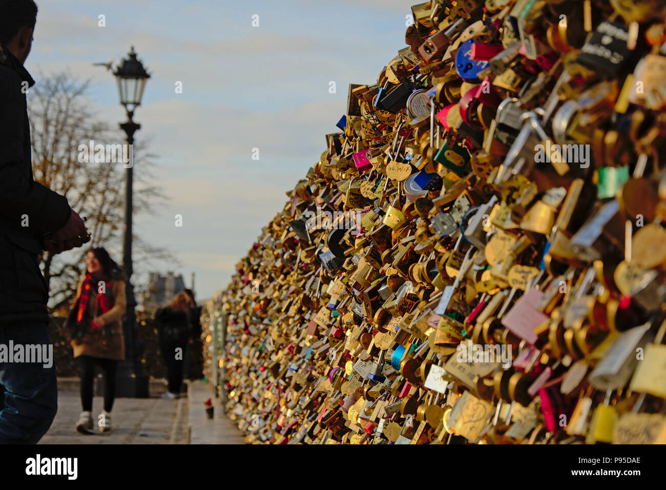 Many Love Locks On Pont Des Arts Bridge In Paris Selective Focus With Blurred People And Lamppost In The Background Stock Photo Alamy