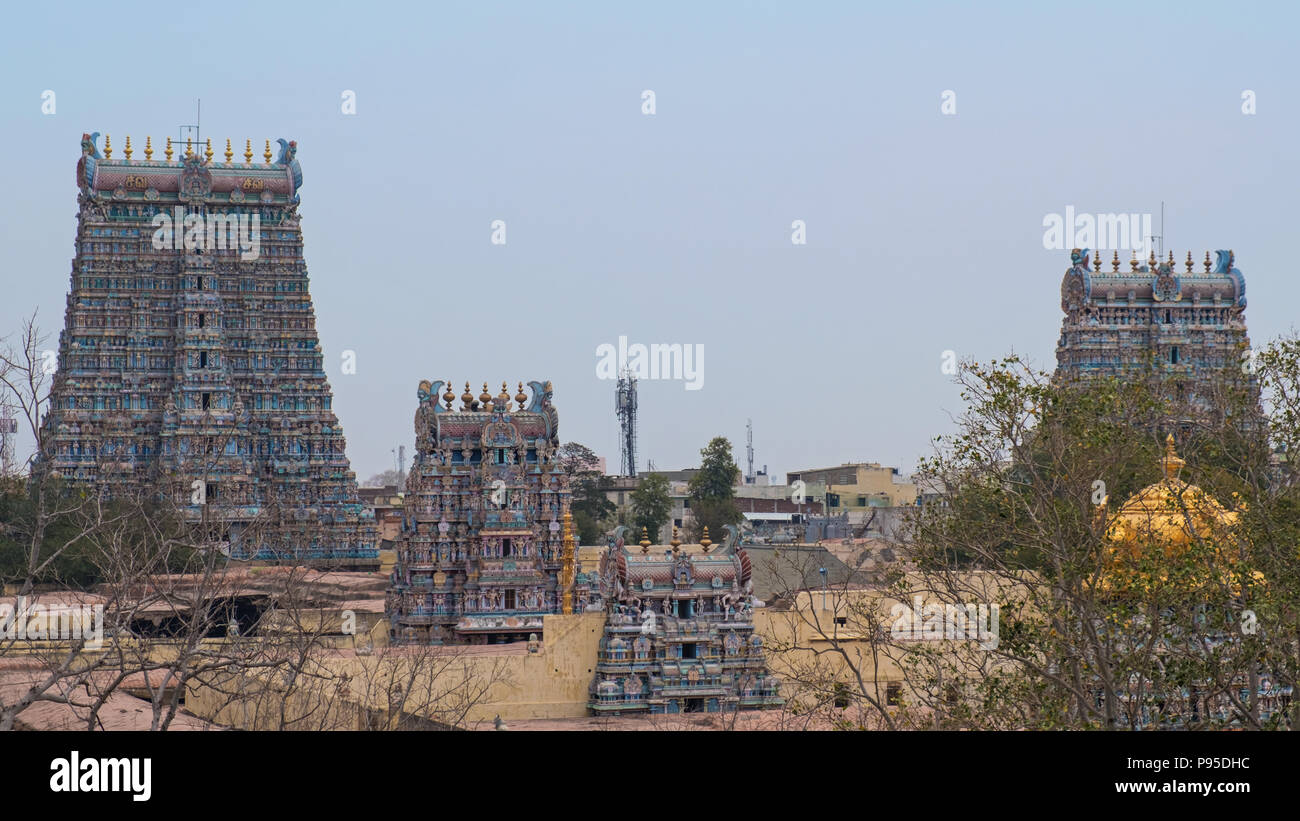 Some of the 14 Gopurams, or gateway towers, of the Meenakshi temple complex covering 45 acres in the heart of Madurai in Tamil Nadu, India Stock Photo