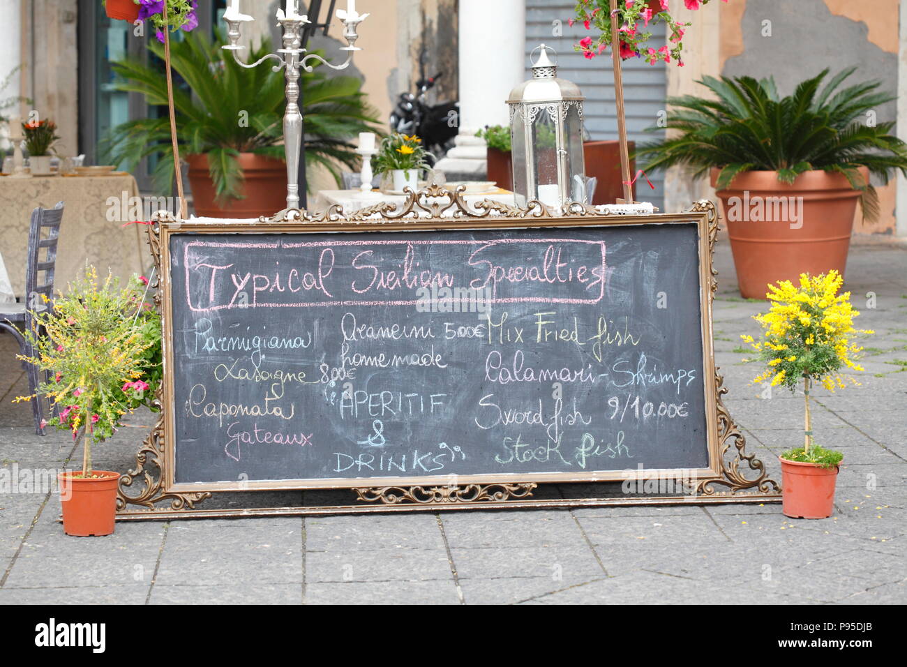 Menu with Sicilian specialties in front of a restaurant in the old town,, Catania, Sicily, Italy, Europe  I  Speisekarte mit Sizilianischen Spezialitä Stock Photo