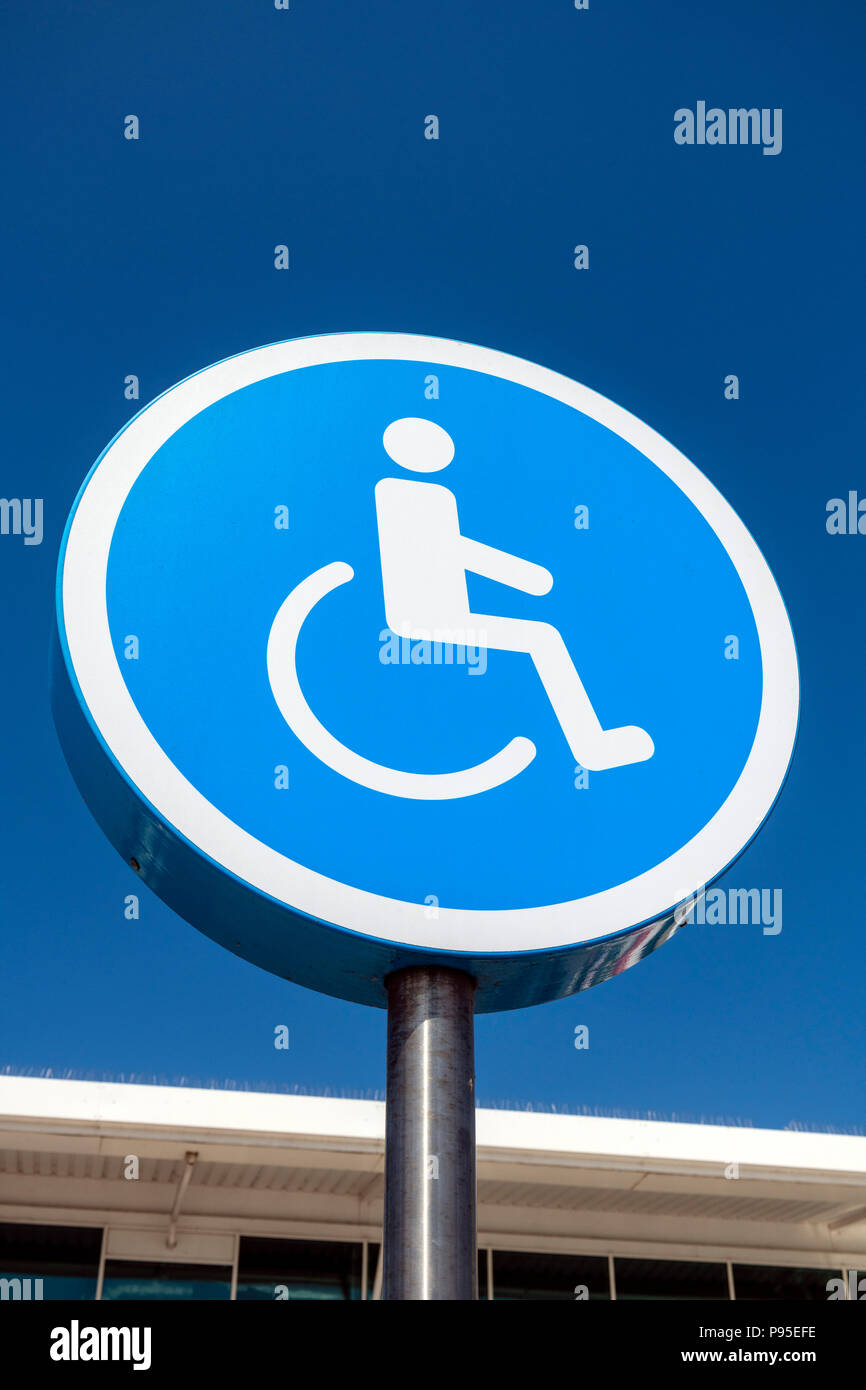 Disabled sign UK. Symbol outside denoting disabled parking. Stock Photo