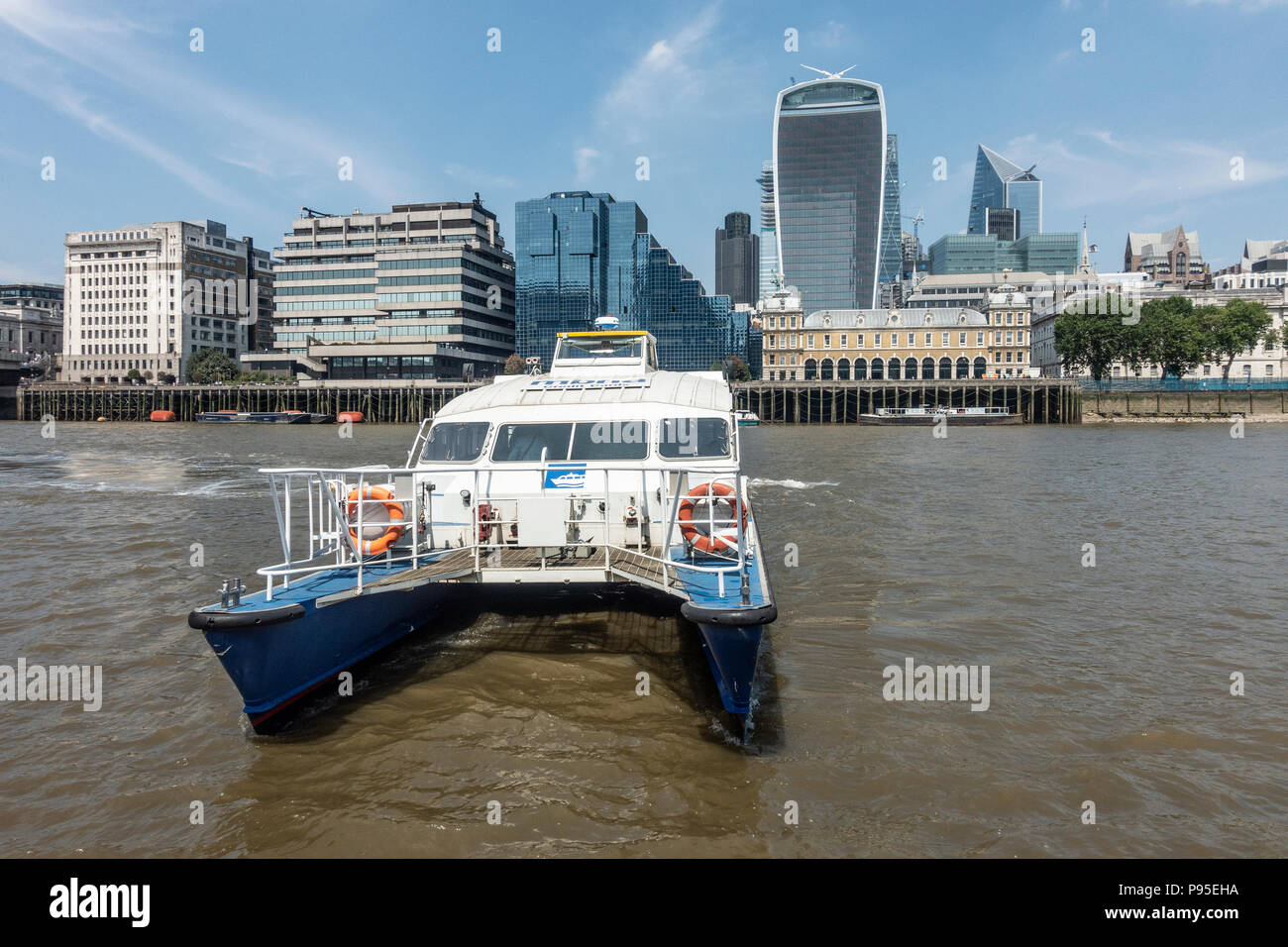 MBNA Thames Clipper Catamaran with the Shell and Northern Building, Tower 42, 52 Lime Street, 20 Fenchurch, the Admiralty, London Stock Photo