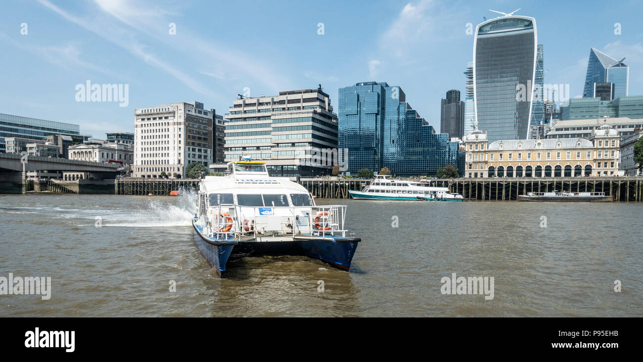 MBNA Thames Clipper Catamaran with the Shell and Northern Building, Tower 42, 52 Lime Street, 20 Fenchurch, the Admiralty, London Stock Photo