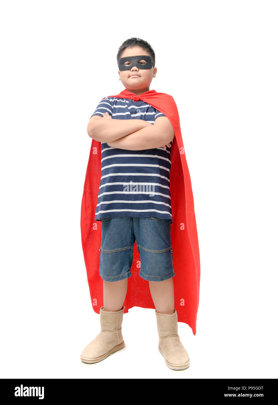 Fat child plays superhero isolated on white background, Boy power concept. Stock Photo