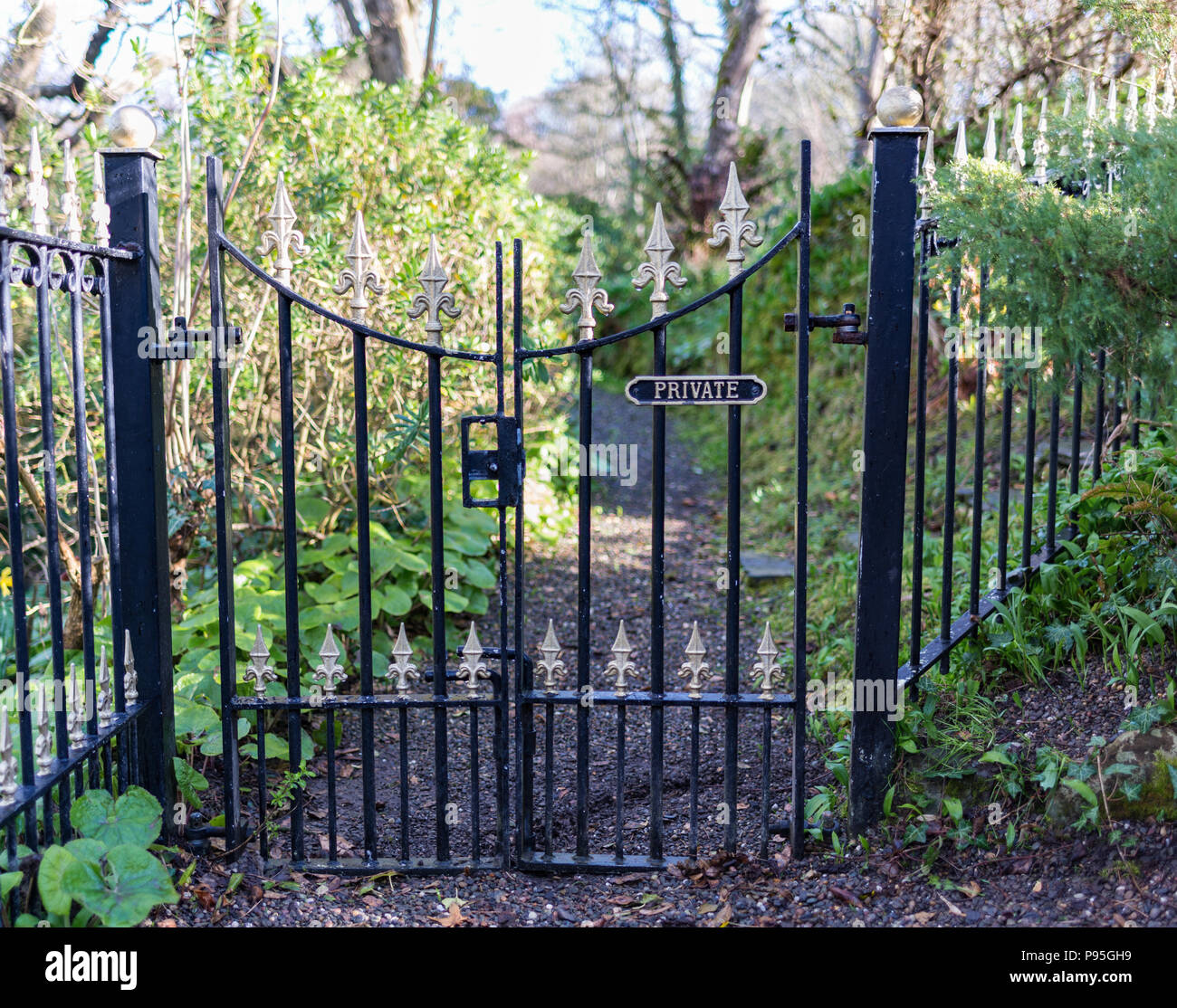 Black iron gate with private sign Stock Photo