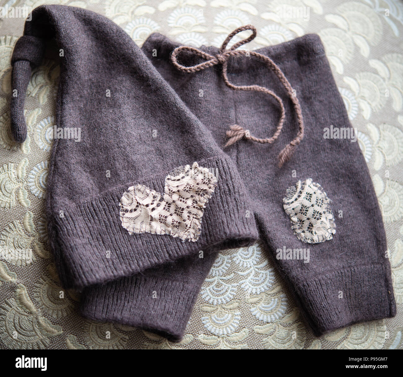 Hand-made newborn photography prop, pants and pixie hat, taupe Stock Photo