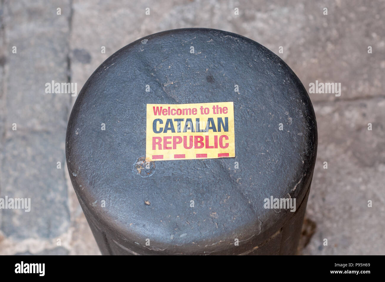 bollard on the street with welcome to catalan republic sticker , Girona, Catalonia, Spain Stock Photo