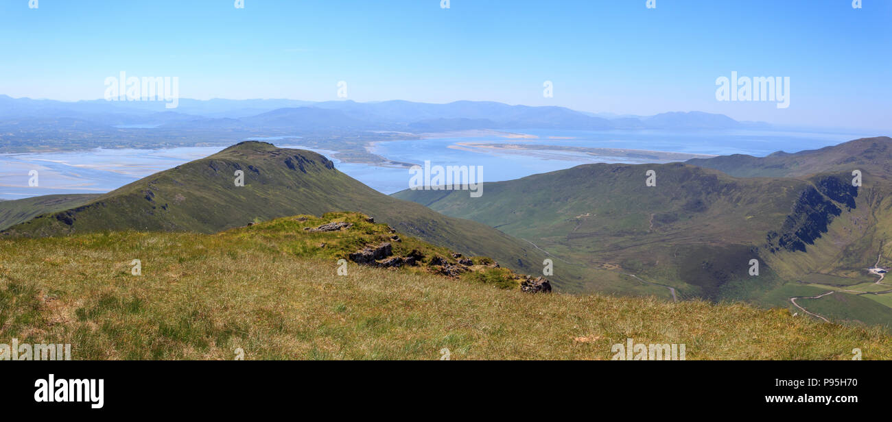 Summer view looking south towards Castlemaine Harbour and the Iveragh Peninsula from Caherconree on the Dingle Peninsula in County Kerry, Ireland Stock Photo