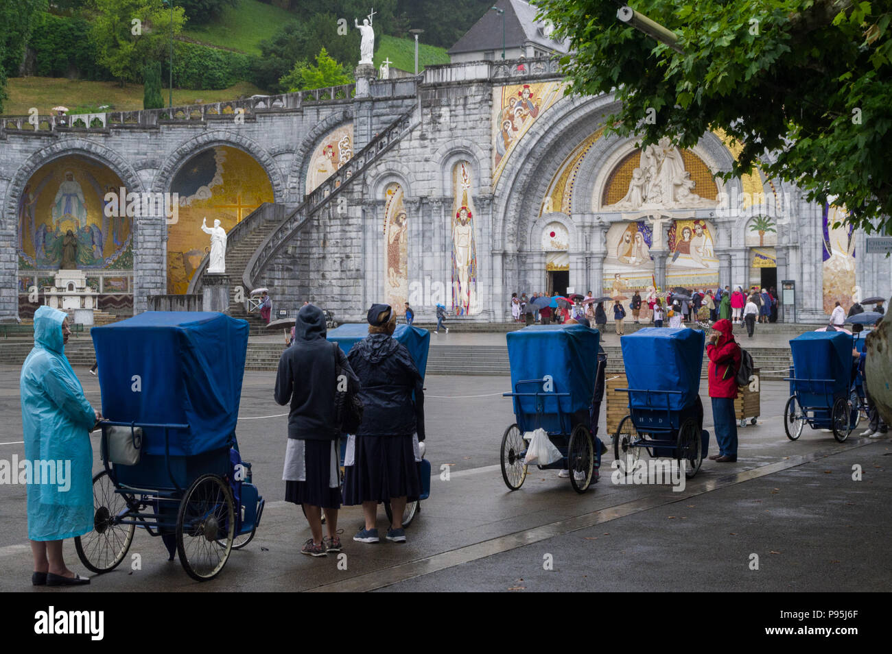 Lourdes, France (5th July 2018) a line of disabled persons on their
