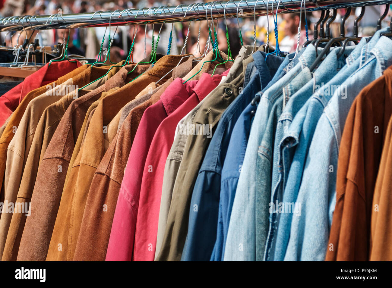 Jackets and shirts on vintage clothing market / second hand fashion flea market Stock Photo