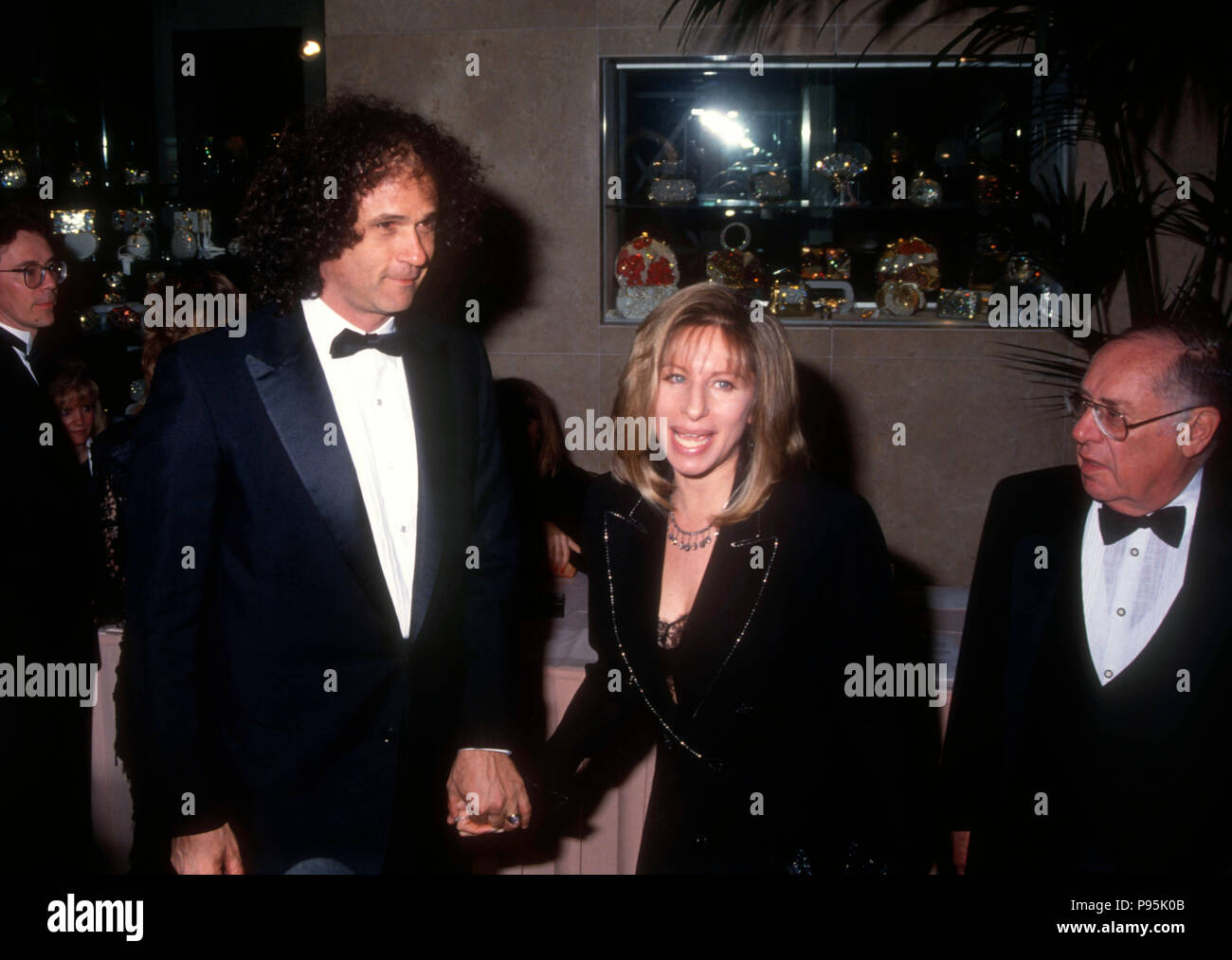 BEVERLY HILLS, CA - MARCH 14: Composer Richard Baskin and singer/director Barbra Streisand attend the 44th Annual Directors Guild of America Awards on March 14, 1992 at the Beverly Hilton Hotel in Beverly Hills, California. Photo by Barry King/Alamy Stock Photo Stock Photo